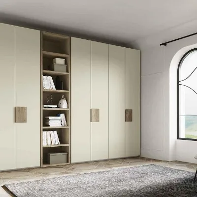 Armadio con ante battenti a prezzo scontato modello Armadio con libreria centrale colore perla opaco di dalcin in promo-sconto del 50% di Dal cin 