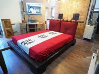 Letto in legno con giroletto Letto zedn japan legno ebambu con cuscinoni red Nuovi mondi cucinea prezzo scontato