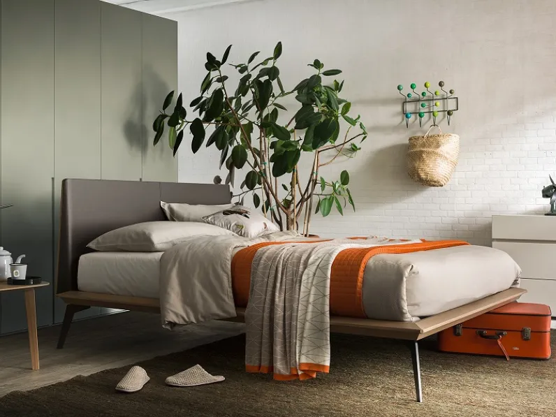 letto legno con testata rivestita cuoio