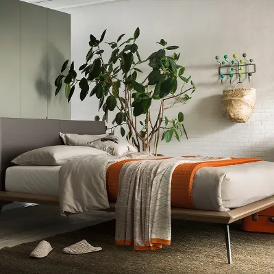 letto legno con testata rivestita cuoio