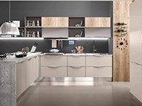 cucina moderna con penisola in grigio cemento